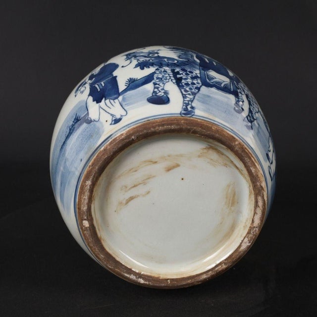 Round lidded Chinese porcelain jar hand‑painted in classic blue‑and‑white. The exterior depicts the traditional "Qilin...