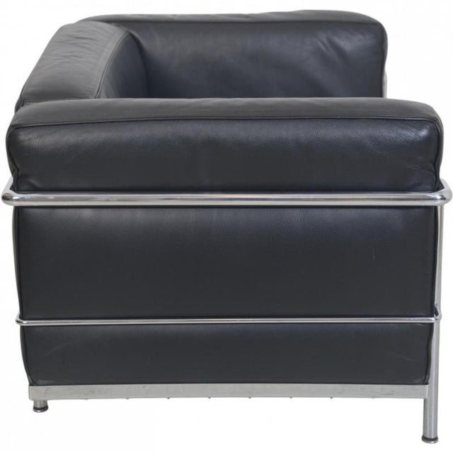Le Corbusier LC3 chair with cushions upholstered in black leather and a chrome steel frame. The chair is from the 2000s...