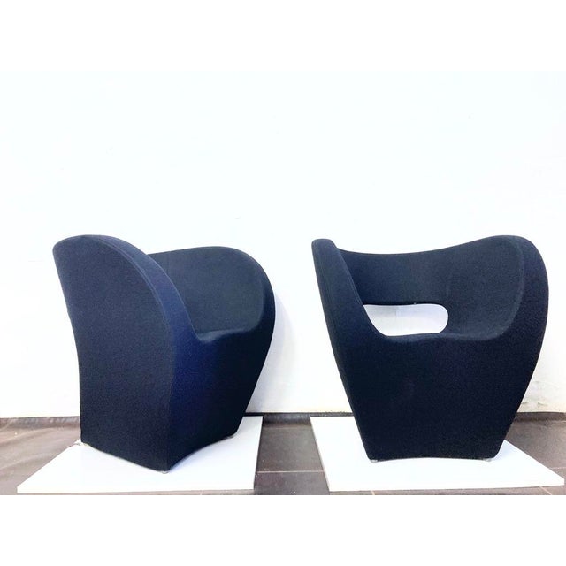 Two armchairs by Moroso. Italy, model Victoria and Albert, designed by Ron Arad, 2000. Metal frame, upholstered in black...