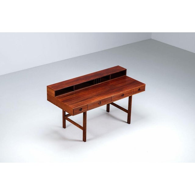 Refined flip-top partners desk designed by Peter Løvig Nielsen and produced by Løvig, Denmark 1954. A celebrated example...