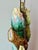 Vintage majolica-style ceramic table lamp featuring large cabbage leaves, a tree trunk, and an oversized flower bud in...