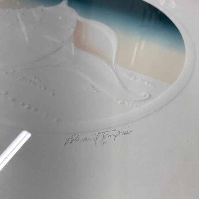 This striking artwork is a signed, embossed print by artist Edward Tompkins, titled “Conch” (written in pencil on the...