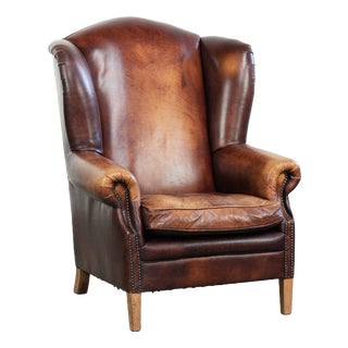 Vintage English Cowhide Wing Armchair For Sale