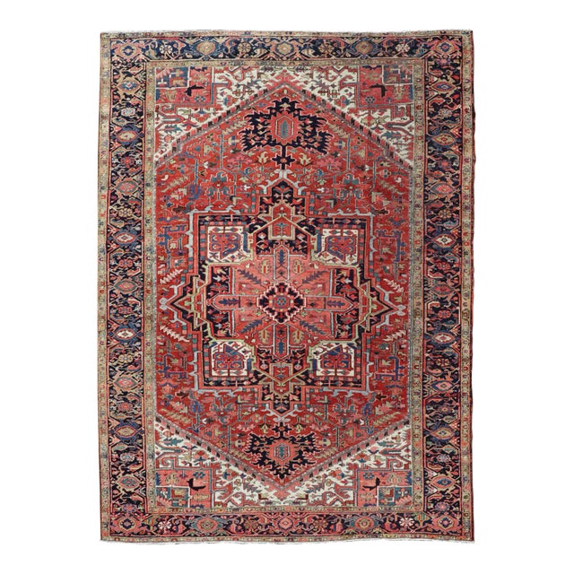 Antique Persian Heriz With Central Medallion Design in Red and Jewel Tones For Sale