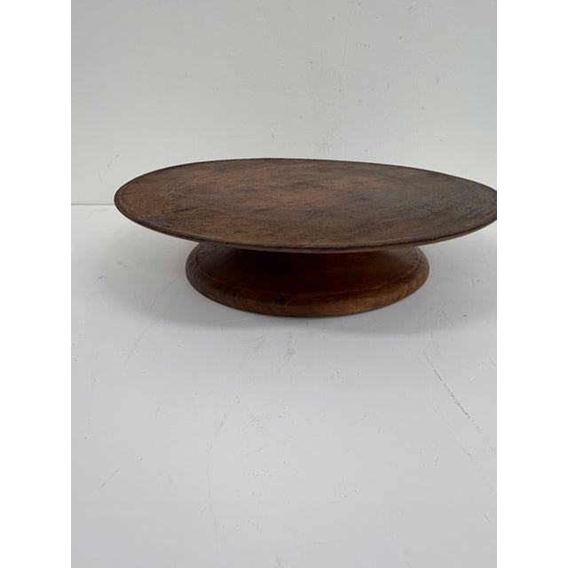 Antique burl wood rotating server with turned pedestal base and rich natural burl grain throughout. Circular form designed...