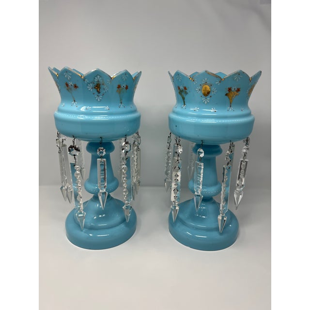 refined matched pair of Victorian mantle lusters in luminous blue opaline glass, likely English, mid-19th century. Each...