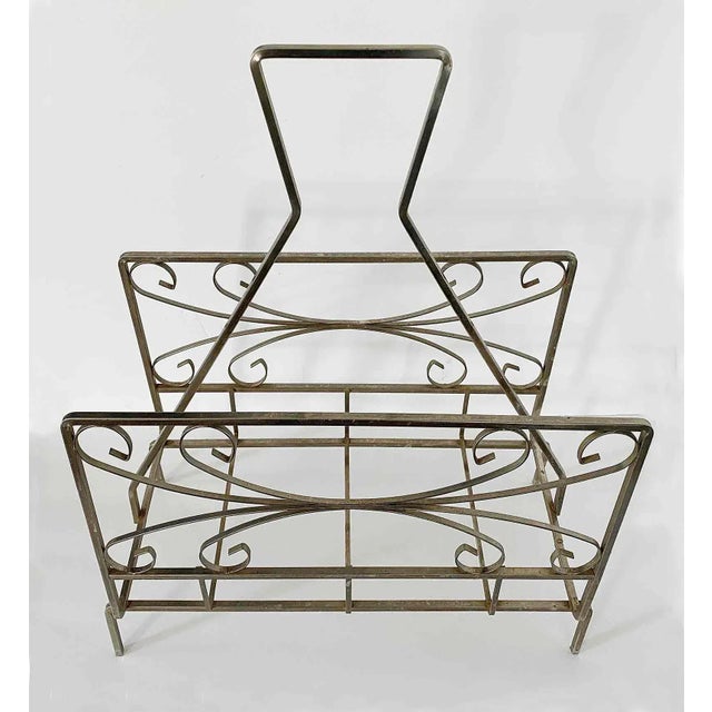 Vintage stainless steel magazine rack with modern design. 1960's-1970's.