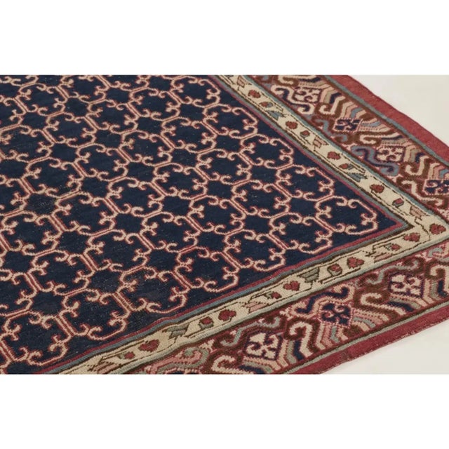 This 8x13 vintage Turkish Anatolian rug, hand-knotted in wool circa 1950–1959, features an elegant allover lattice of...