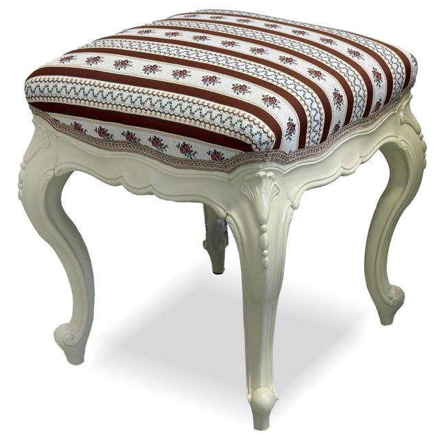Rococo Revival stool dating from around 1870. Featuring gracefully carved details and elegant cabriole legs inspired by...