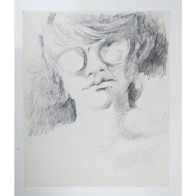 Late 20th century pencil on paper portrait drawing of young man wearing glasses. Unsigned. Unframed, age toning.