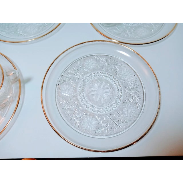 Eight piece plate and cup set made by Anchor Hocking in the 1960s. The set is sandwich Clear and desert gold trimmed. Some...