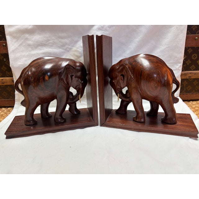 An unusually large pair of carved teak elephant bookends, the elephants themselves standing over 8" tall, the overall...