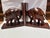 An unusually large pair of carved teak elephant bookends, the elephants themselves standing over 8" tall, the overall...