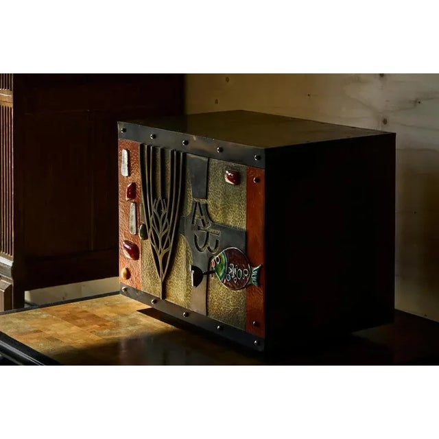 A breathtakingly beautiful decorative cabinet in metal, brass, enamel and gemstones. Belgium, mid 20th century. A bespoke...