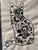 Hand-made framed hand embroidery or crewel-style embroidery on natural linen or linen-blend fabric, depicting a cat filled...
