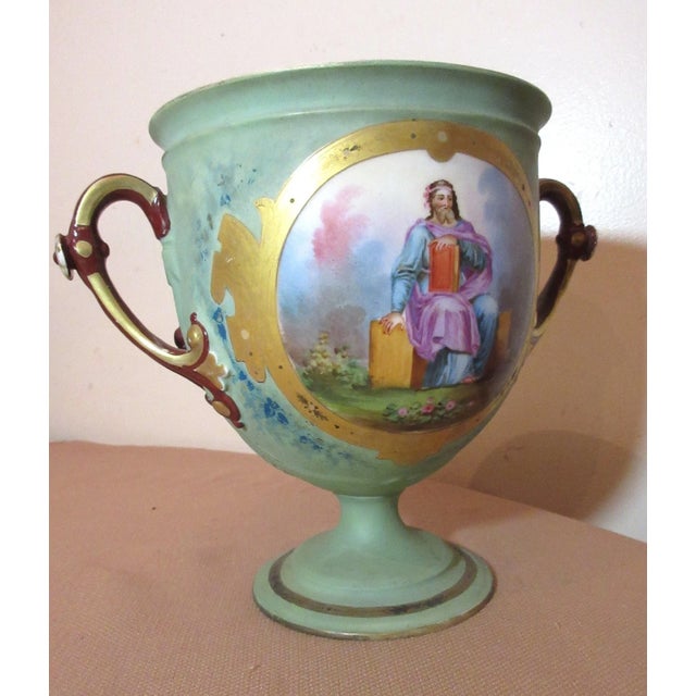Up for sale is a wonderful antique hand painted 19th century porcelain trophy style urn. It's nicely painted by hand with...