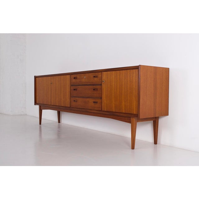 Scandinavia, 1960s: teak sideboard with 3 doors. W 240 cm x d 45 cm x h 83 cm. Usable depth 32 cm (shelf) - interior...