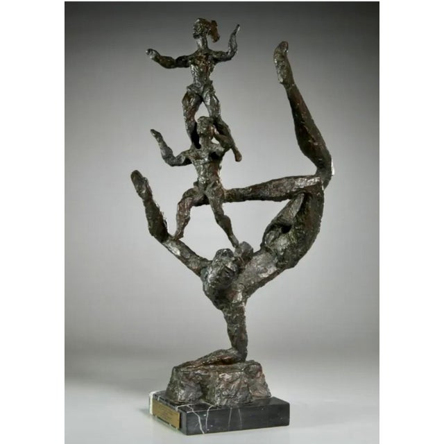 Chaim Gross (American, 1904-1991) Patinated cast bronze sculpture, Three Acrobats, signed mounted on black marble plinth...