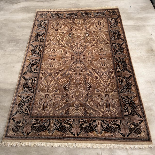A vintage 1970s hand-knotted wool rug featuring a striking geometric medallion design inspired by early 20th-century Art...