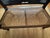 Elevate your space with this sophisticated bench, which features hand-carved woodwork, a slat sunburst carved back with...