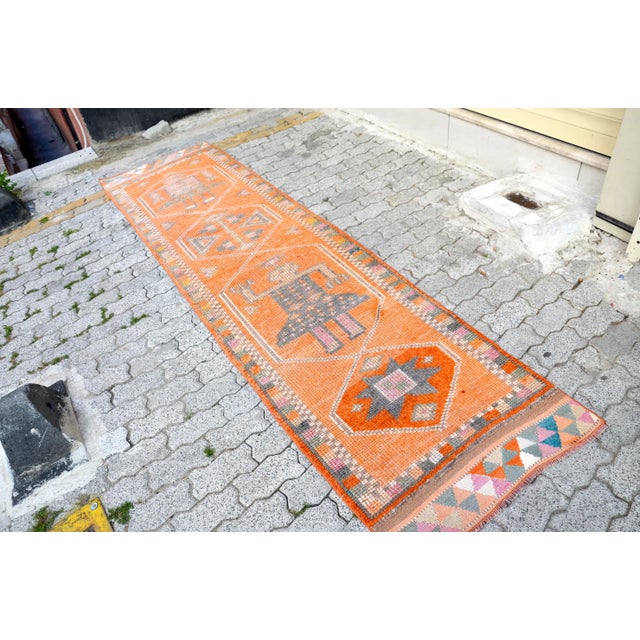 This is a vintage Turkish Oushak rug from the 1960s. The piece was hand-knotted.