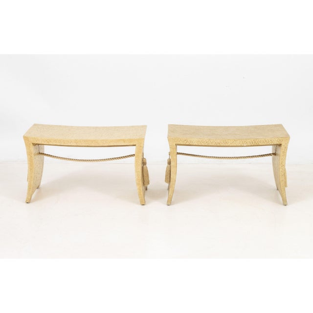 Pair of Thomas Pheasant for Baker Furniture Tassel Pagoda Benches, each with silk tassels, splayed legs, and cream crackle...