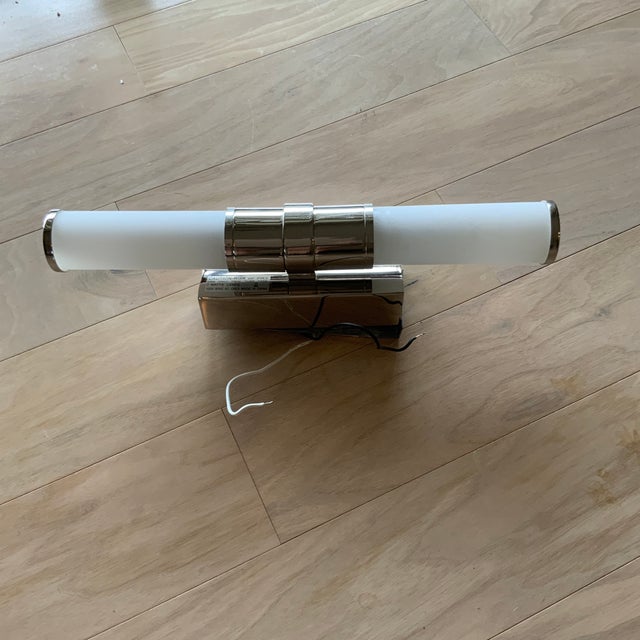 This beautiful Robert Abbey wall sconce can be used alone or in a pair. It can be placed over a mirror if used...