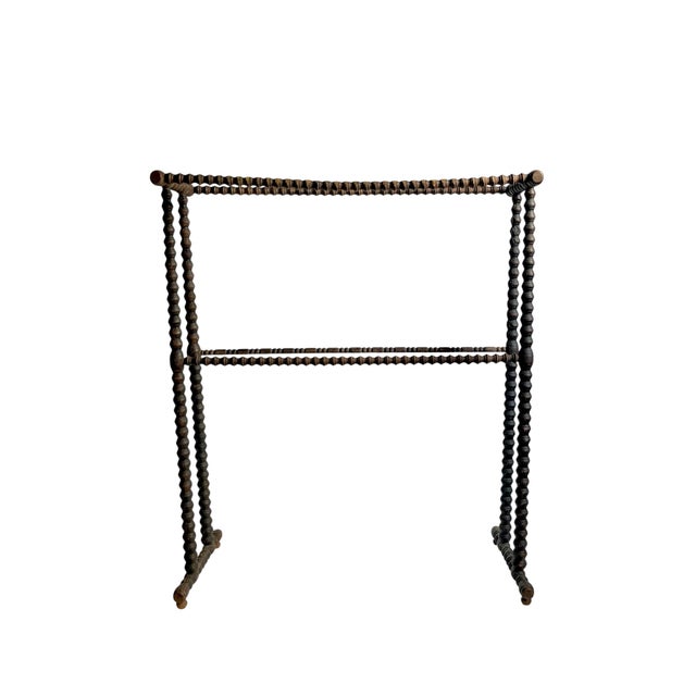 A beautifully crafted antique blanket stand featuring classic bobbin-turned detailing throughout, lending it a distinctive...