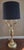 Brass bouillotte style candelabra table lamp. Elegant base supports 3 arms each with a light as well as the center light....