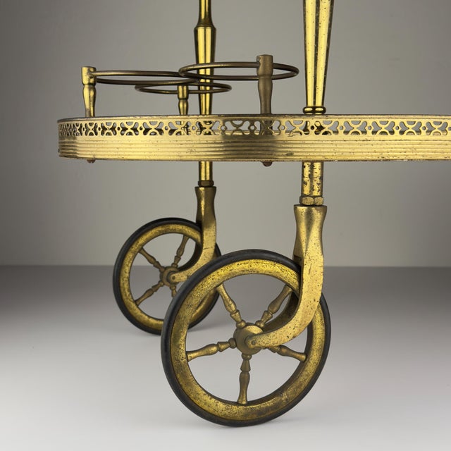 Elegant bottle trolley designed and created in Italy in the glamorous era of the 1960s. It can be used as a side table, a...