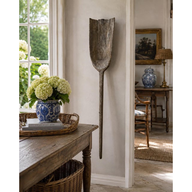 A wonderfully sculptural late 19th century wooden grain shovel, hand-hewn with a beautifully weathered surface that only...