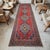 Woven on a traditional family loom in Central Anatolia during the 1960s, this remarkable vintage runner rug presents an...