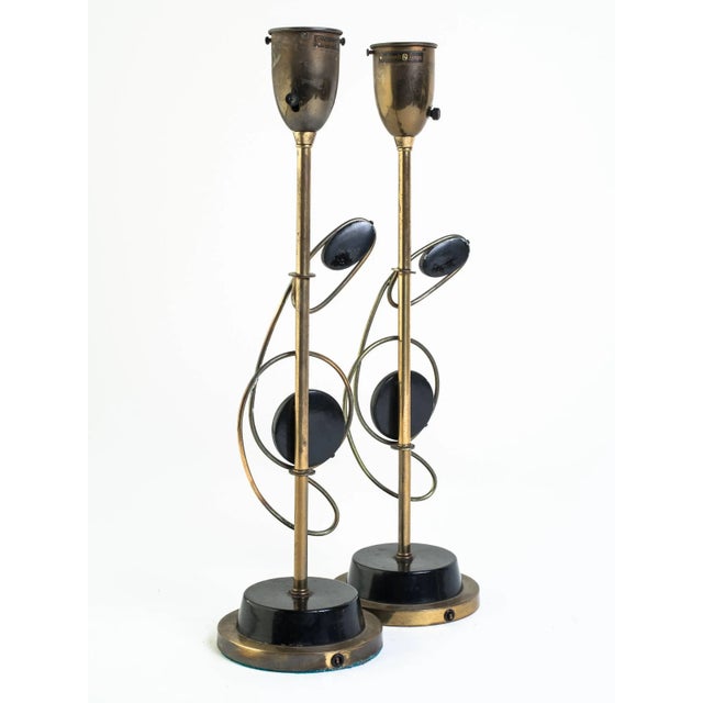 Pair of 1950s atomic brass lamps.