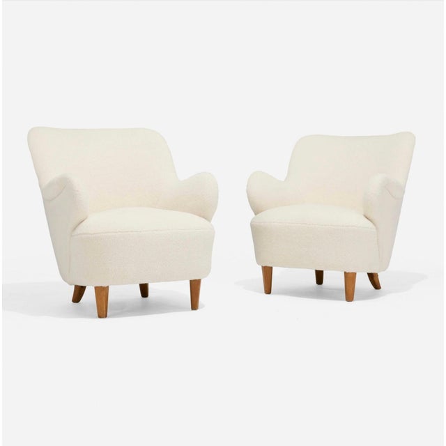 A nice pair of mid 1940’s club chairs Attributed to Gustav Axel Berg of Sweden. Reupholstered in an off white boucle. Good...