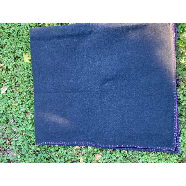 A sumptuous heavyweight cashmere throw embellished with a hand sewn blanket stitched edge.