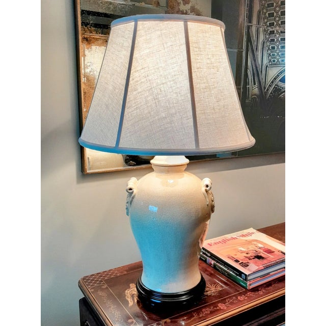 Made by "Oriental Danny" this is a large crackle glazed lamp in cream color atop dark brown wood base. I have added a new...