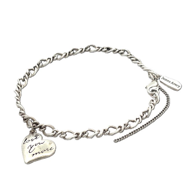 Authentic James Avery sterling silver charm bracelet featuring a dangling heart charm engraved with “Love You More.”...