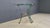 Vintage French console with a green metal and brass frame and a beveled glass top. Beautiful piece inspired by the designs...
