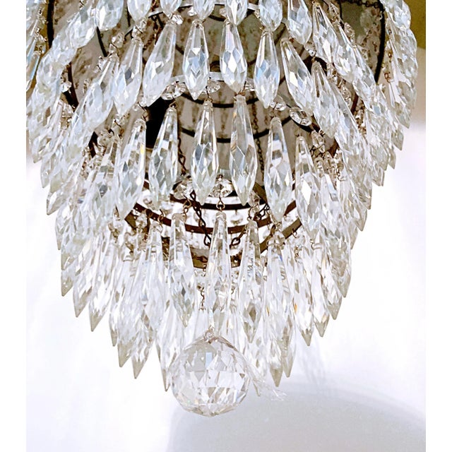 Italian layered chandelier with decorative silver rim, plain beads and hand blown U-drop. It has 5 layers of crystals and...
