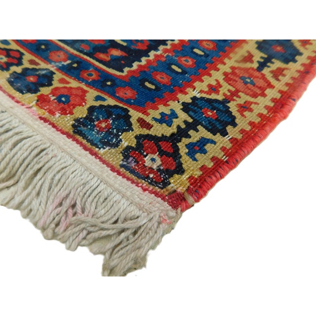 Antique Persian, Bijar flat woven kilim with Concentric geometric medallions surrounded with blue field decorated with...