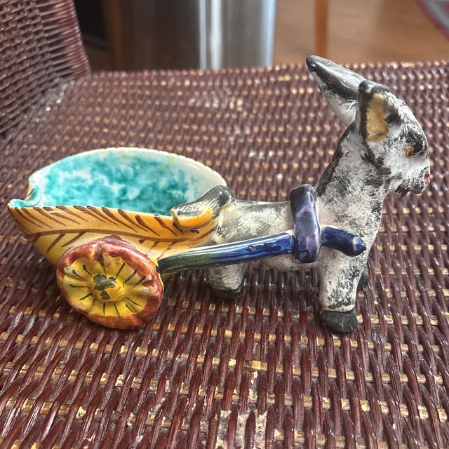 Italian Pottery Donkey pulling a cart. This donkey has a stamped ITALY mark which means it's made by an unknown...