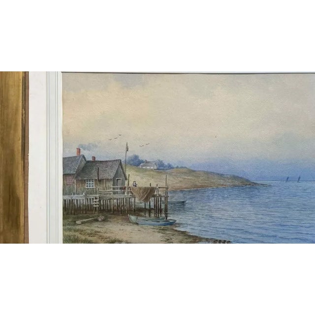 A lovely original watercolor of a cottage by the sea, showing a fisherman draping his nets over the porch rail to dry. I...