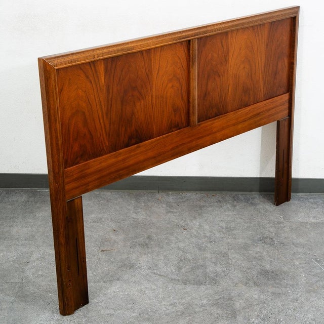 Handsome and timeless mid century modern queen size headboard by Dixie furniture crafted from wood with a rich finish....