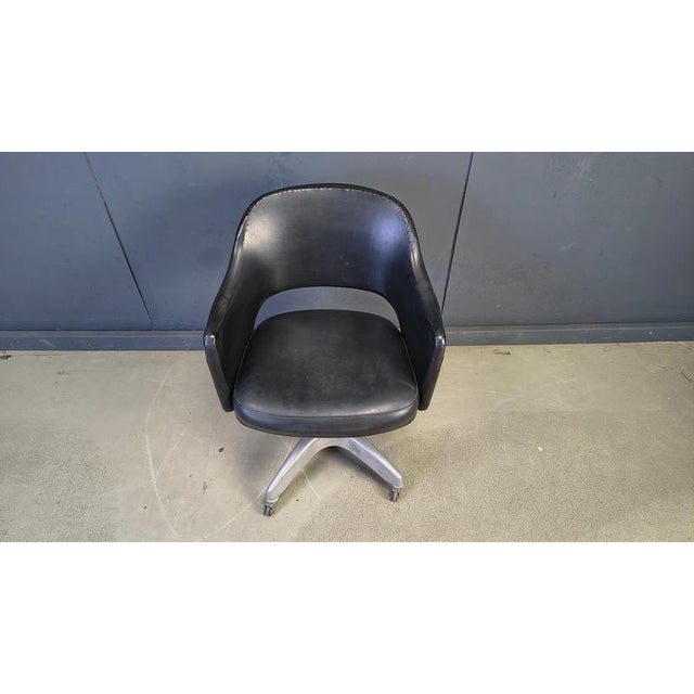 Beautiful and original 1950s mid century desk/office chairs. Beautifully shaped simili leather seat mounted on a brushed...