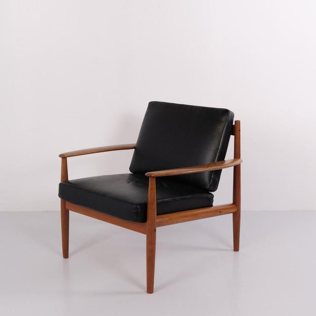 Armchair designed by danish furniture designer grete jalk and manufactured by france & søn during the 1960s. The chair...