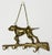 Vintage brass hunting dog key holder wall hook featuring a pointer dog atop a hunting rifle with four (4) hooks for keys....