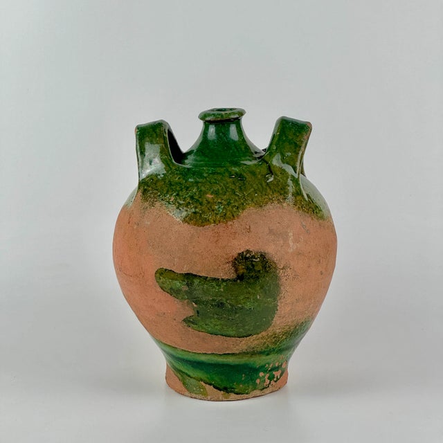 A most beautiful 19th Century French pottery Jug with green glaze and handles. We especially love the abstract green glaze...