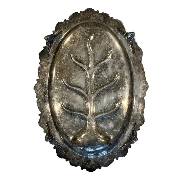 Silver-plated on copper footed meat platter with tree well design by Sheridan Silver Company