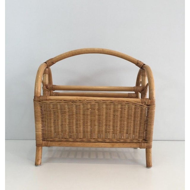 This nice magazine rack is made of rattan. This is a French work. Circa 1970