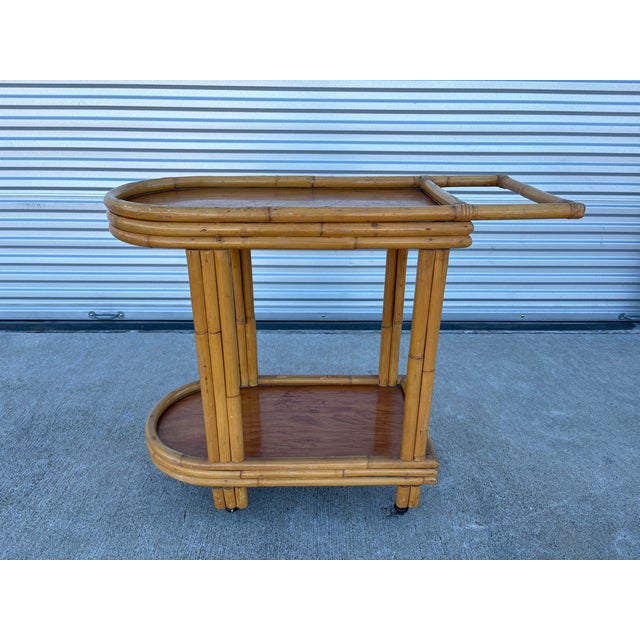 Mid Century Bamboo Bar Cart. Offered is a handsome bar cart, serving cart or drinks trolley made of bamboo with smooth...